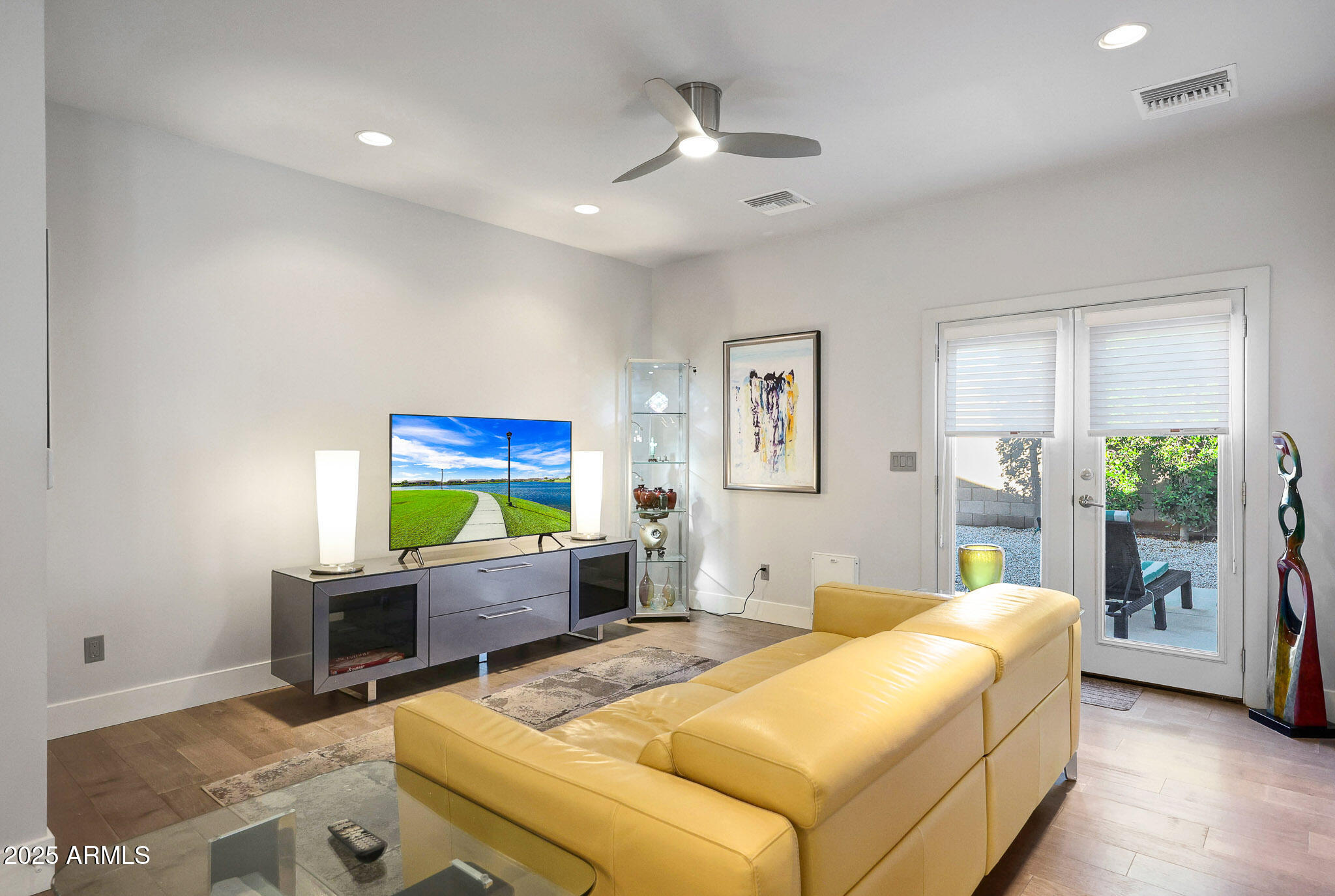 4435 North 35th Street Phoenix, AZ 85018 - Photo 13 of 35 a bed room with furniture and a flat screen tv