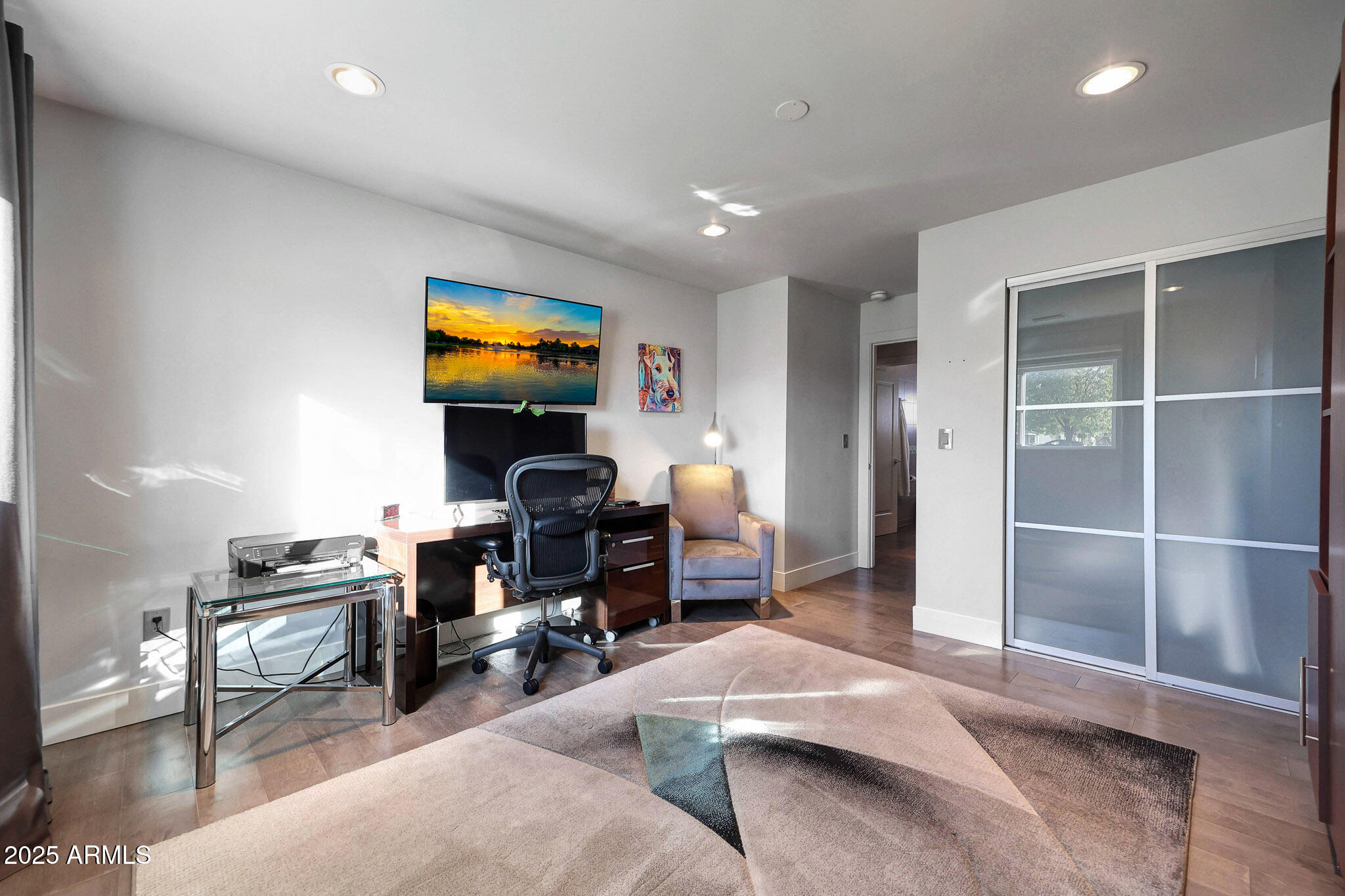4435 North 35th Street Phoenix, AZ 85018 - Photo 16 of 35 a bedroom with a bed and a gym equipment