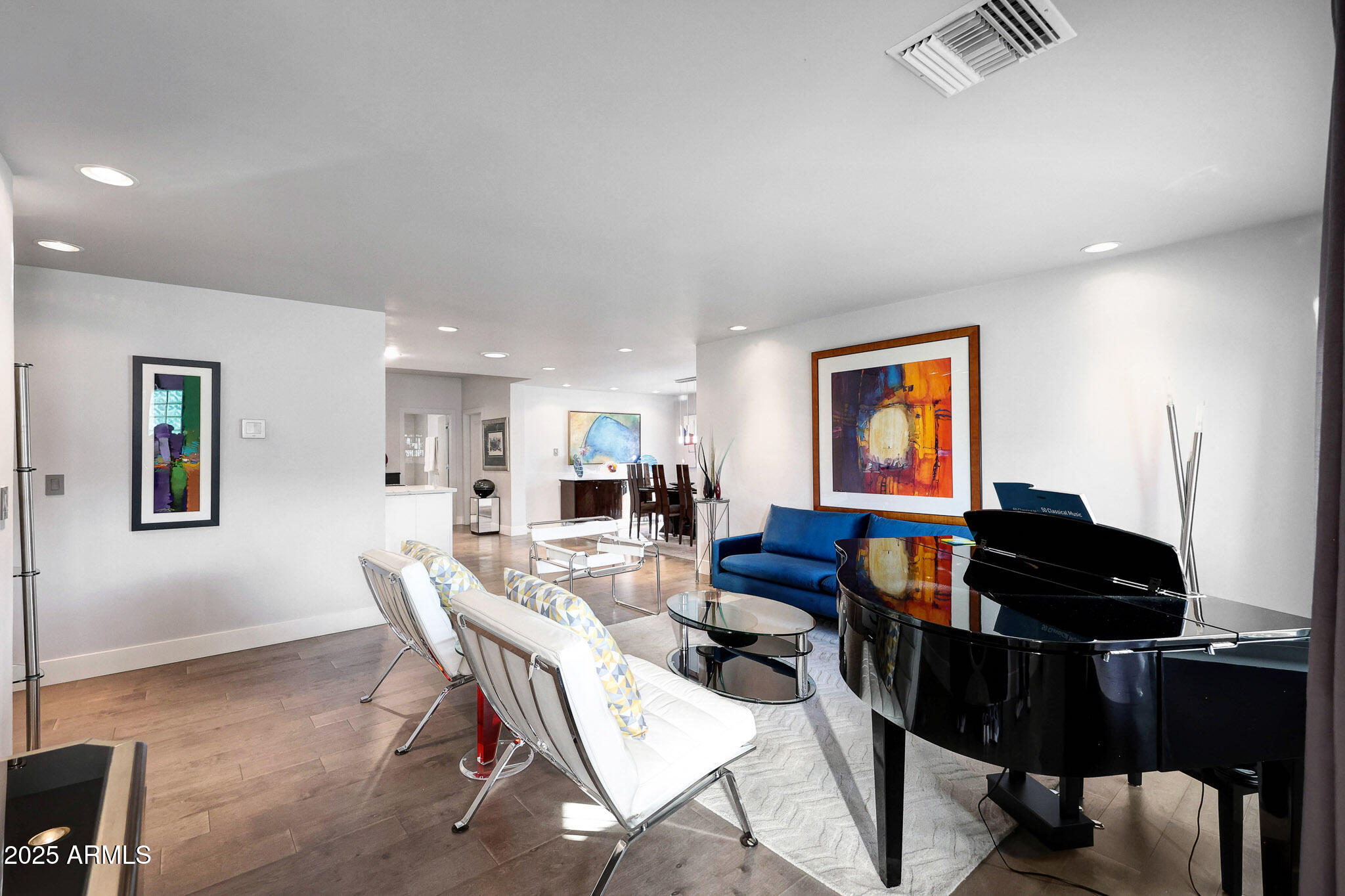 4435 North 35th Street Phoenix, AZ 85018 - Photo 17 of 35 a living room with furniture and a flat screen tv