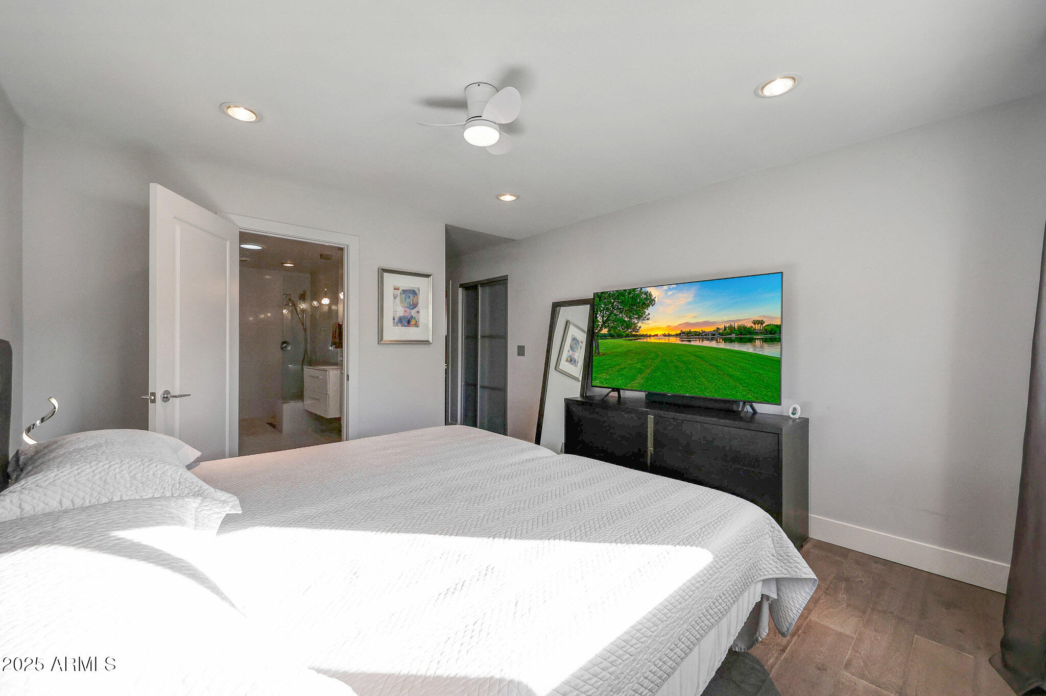 4435 North 35th Street Phoenix, AZ 85018 - Photo 19 of 35 a bedroom with a bed and a flat screen tv