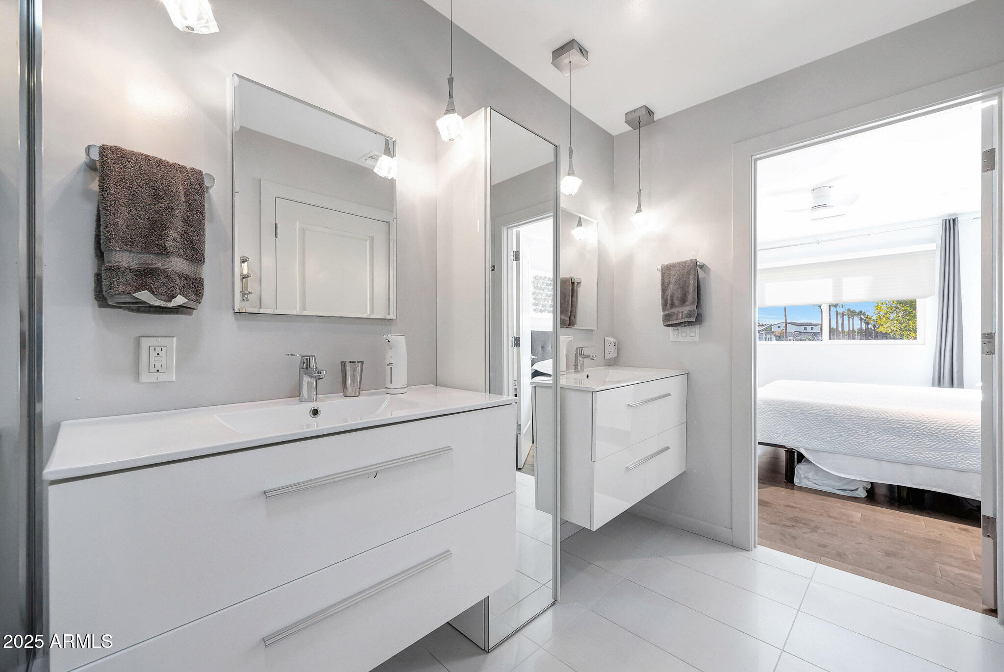 4435 North 35th Street Phoenix, AZ 85018 - Photo 21 of 35 a bathroom with a sink double vanity and a mirror