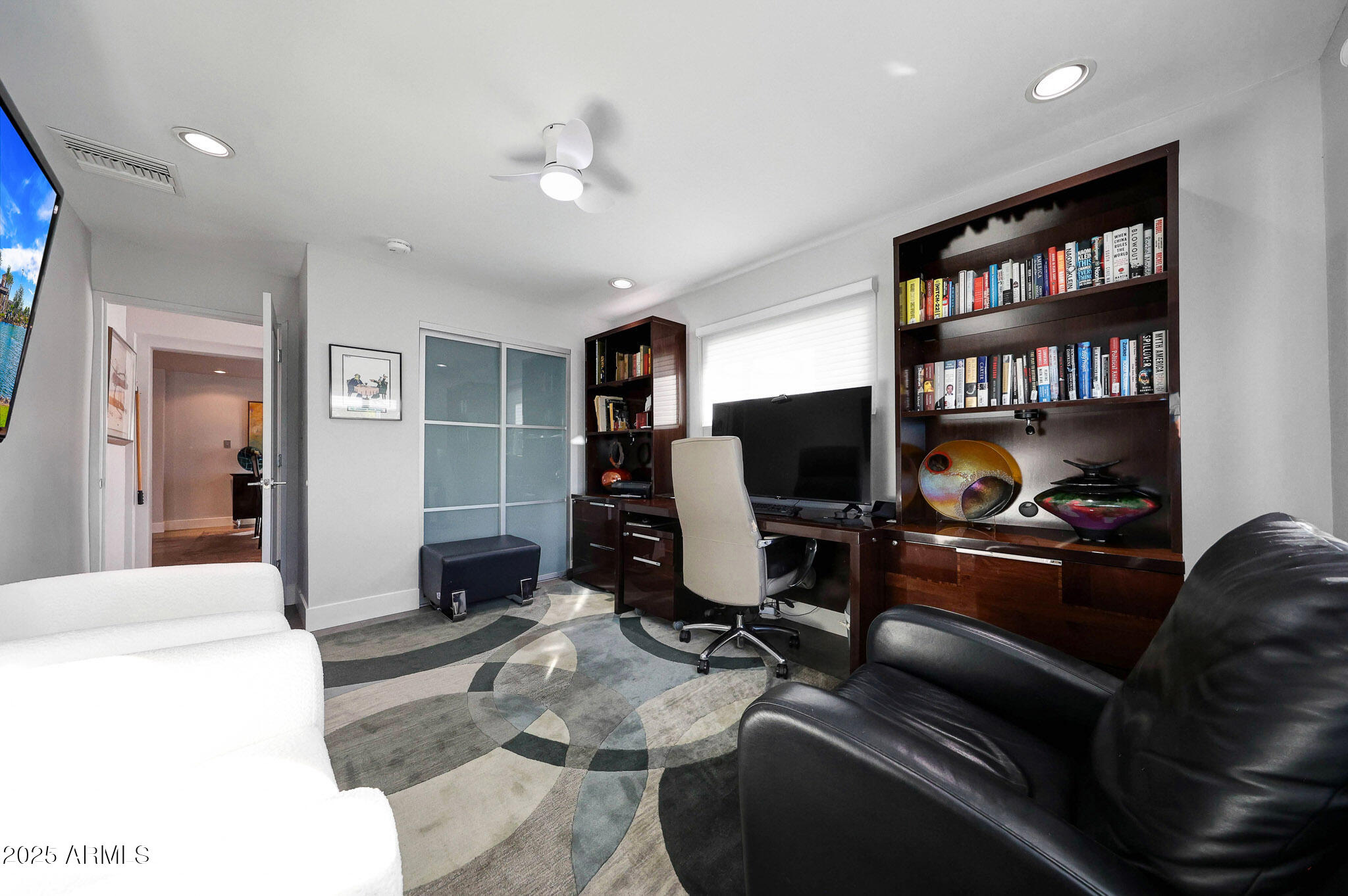 4435 North 35th Street Phoenix, AZ 85018 - Photo 25 of 35 a living room with furniture and a flat screen tv