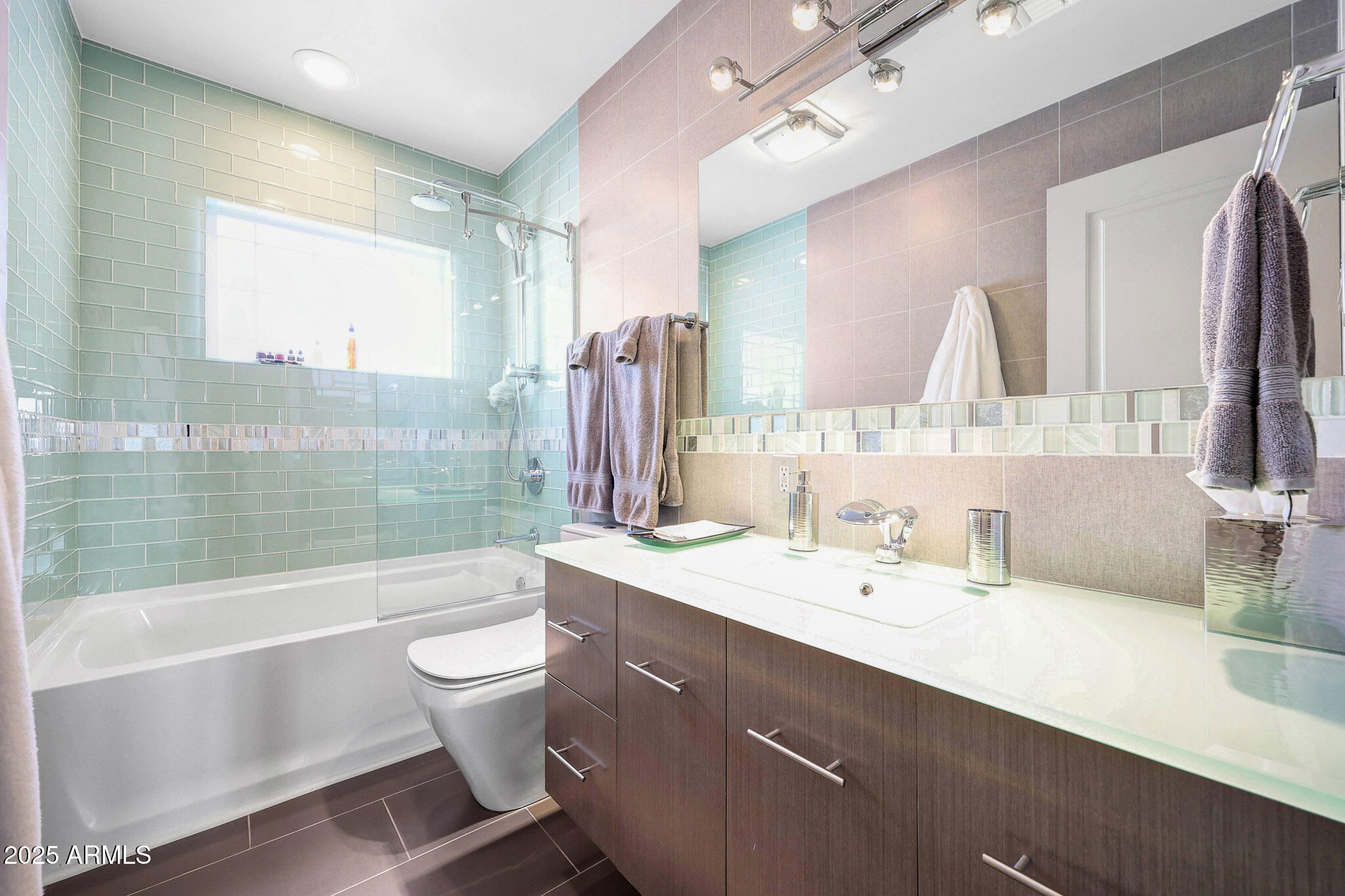 4435 North 35th Street Phoenix, AZ 85018 - Photo 28 of 35 a bathroom with a double vanity sink toilet mirror and bathtub