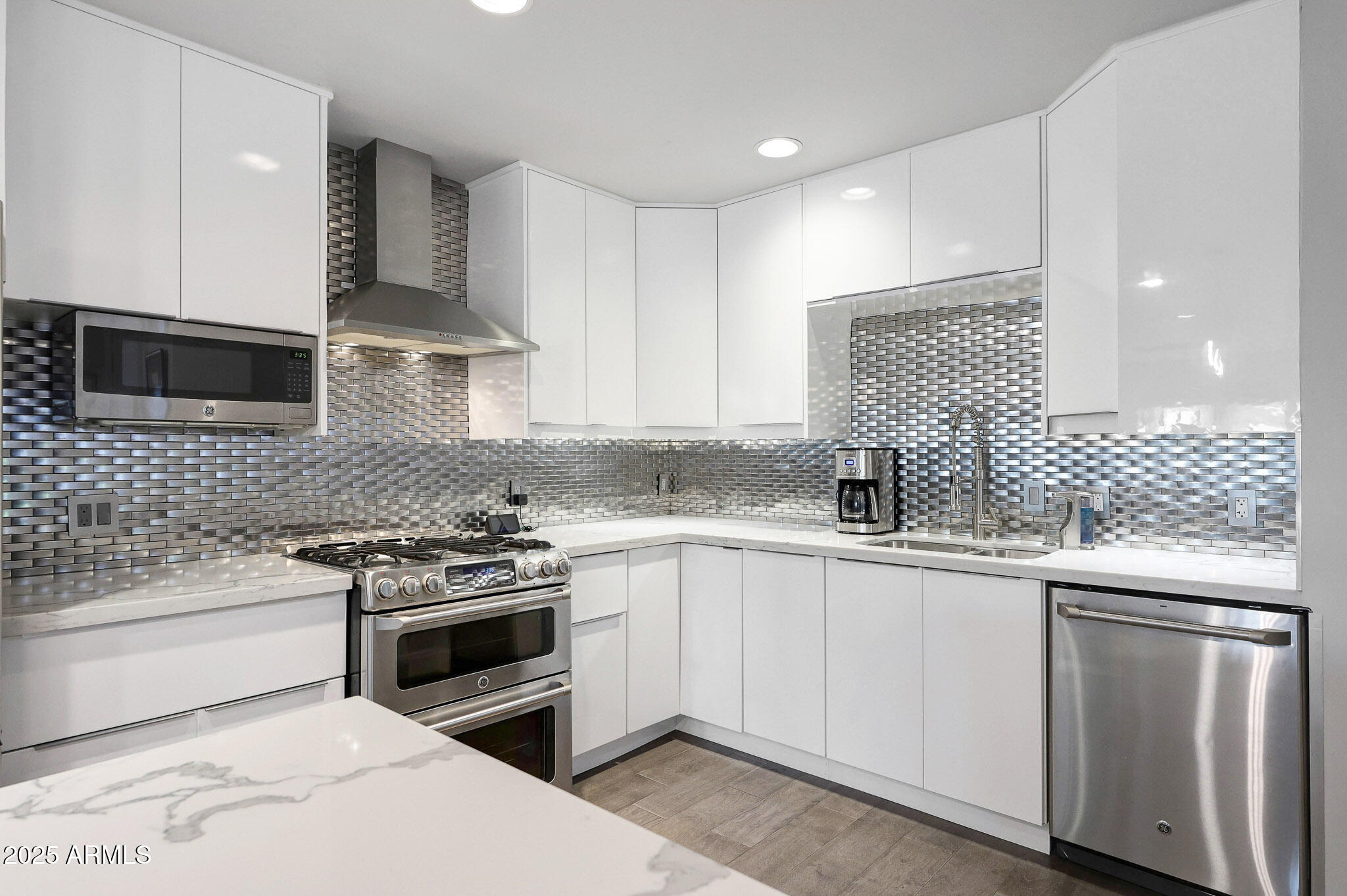 4435 North 35th Street Phoenix, AZ 85018 - Photo 3 of 35 a kitchen with granite countertop a sink stainless steel appliances and cabinets