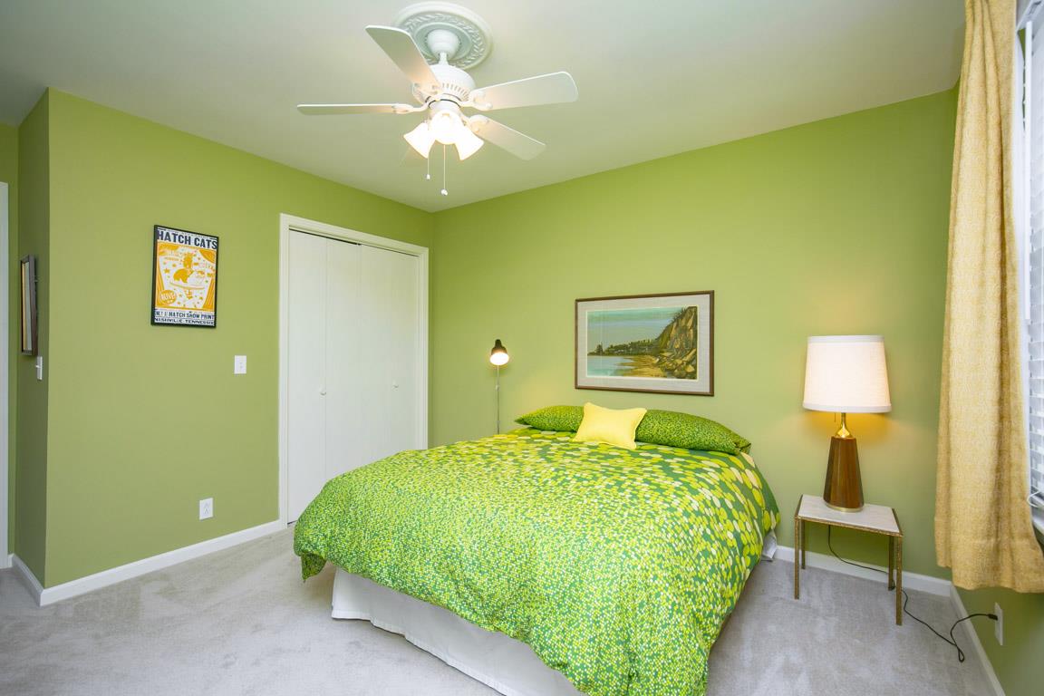 885 Holly Tree Gap Road Brentwood, TN 37027 - Photo 15 of 28 a bedroom with a bed and a painting on the wall