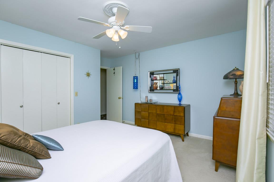 885 Holly Tree Gap Road Brentwood, TN 37027 - Photo 17 of 28 a bedroom with a bed and dresser