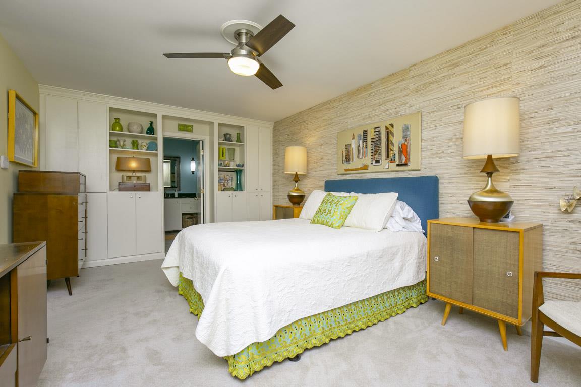 885 Holly Tree Gap Road Brentwood, TN 37027 - Photo 20 of 28 a bedroom with a bed and a refrigerator