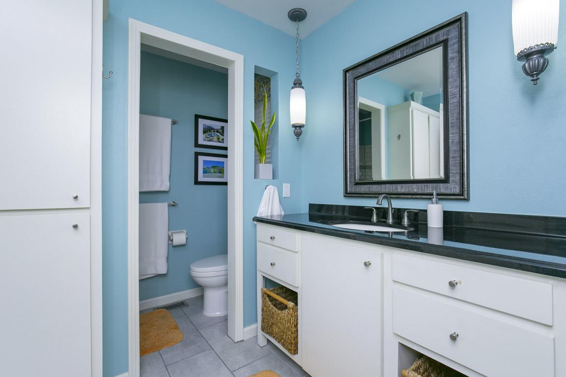 885 Holly Tree Gap Road Brentwood, TN 37027 - Photo 21 of 28 a bathroom with a granite countertop sink mirror and toilet