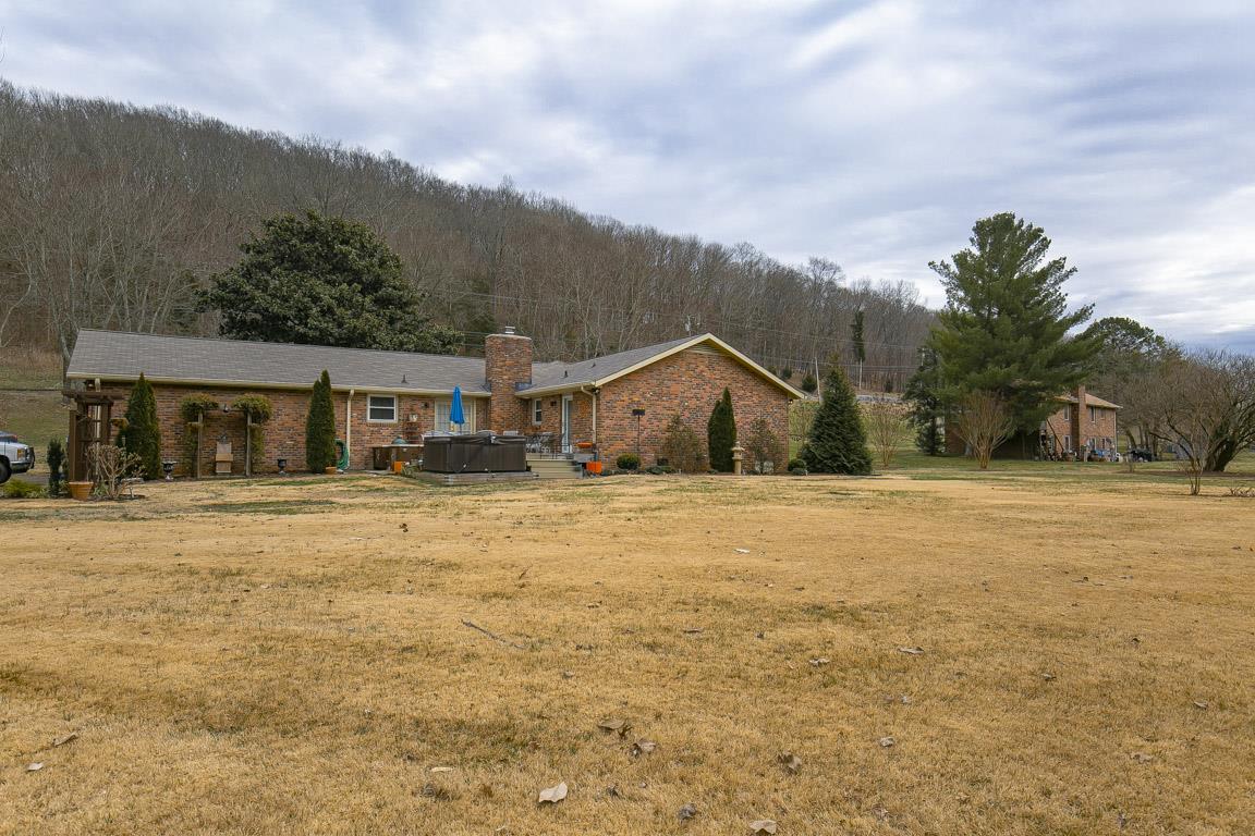 885 Holly Tree Gap Road Brentwood, TN 37027 - Photo 25 of 28 a front view of house with yard and green space