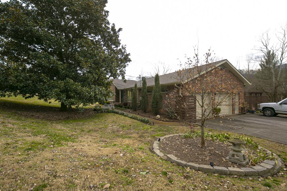 885 Holly Tree Gap Road Brentwood, TN 37027 - Photo 3 of 28 a view of a house with a yard