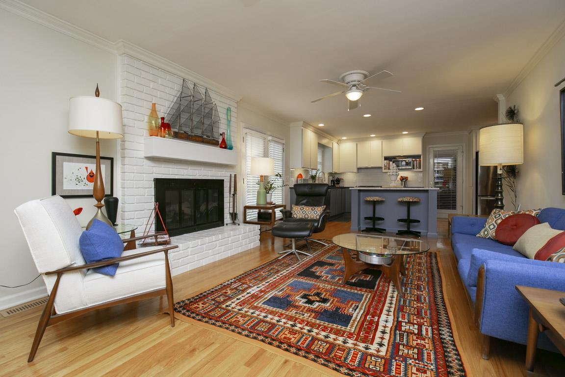 885 Holly Tree Gap Road Brentwood, TN 37027 - Photo 6 of 28 a living room with furniture and a fireplace