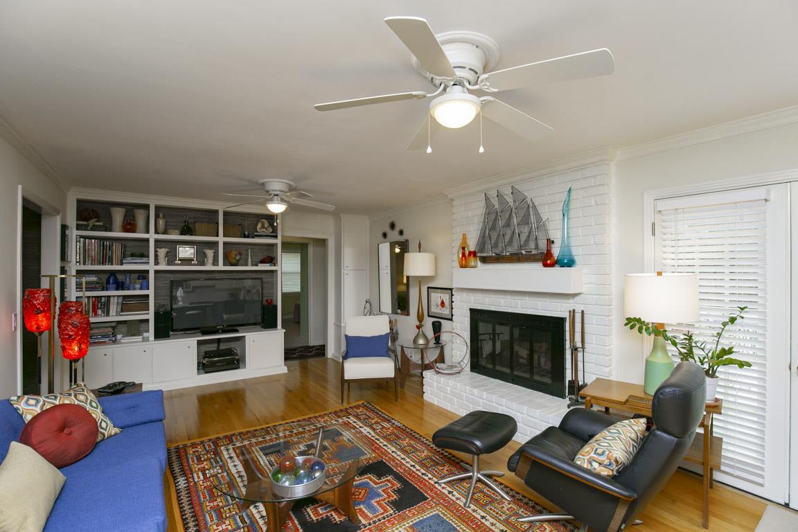 885 Holly Tree Gap Road Brentwood, TN 37027 - Photo 7 of 28 a living room with furniture and a fireplace