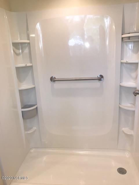 94 Cedar Tree Lane Southwest Calabash, NC 28467 - Photo 30 of 41 Easy in/out shower - no big step and safety rail