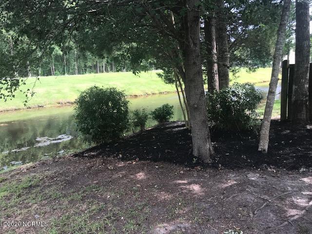 94 Cedar Tree Lane Southwest Calabash, NC 28467 - Photo 33 of 41 Shady yard with pond view