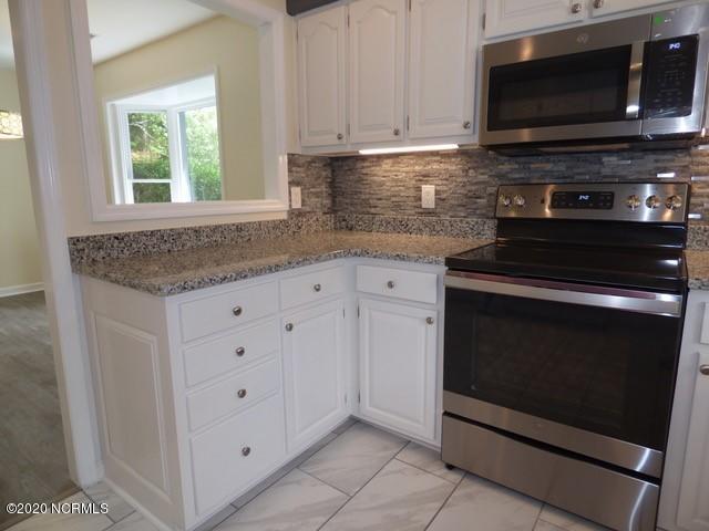94 Cedar Tree Lane Southwest Calabash, NC 28467 - Photo 7 of 41 Kitchen - new granite countertops, backs