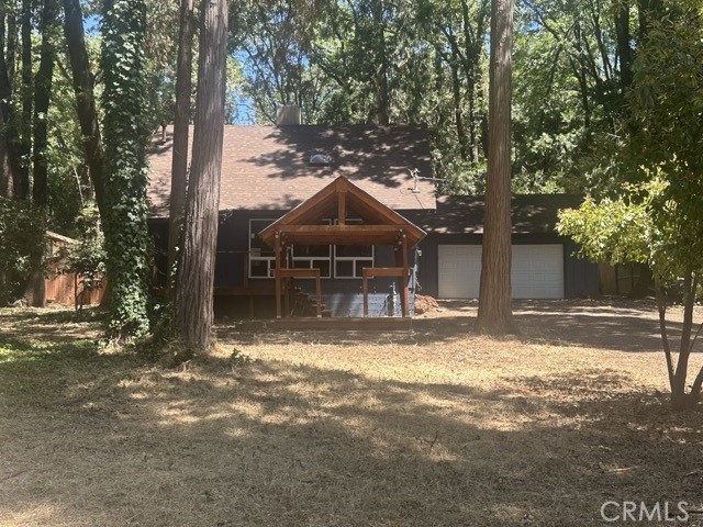 14301 Sinclair Circle Magalia, CA 95954 - Photo 1 of 13 a view of a house with a yard