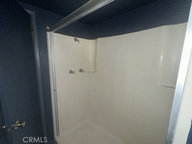 14301 Sinclair Circle Magalia, CA 95954 - Photo 13 of 13 a bathroom with a glass shower door
