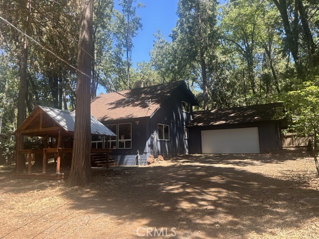 14301 Sinclair Circle Magalia, CA 95954 - Photo 2 of 13 a view of a street with houses