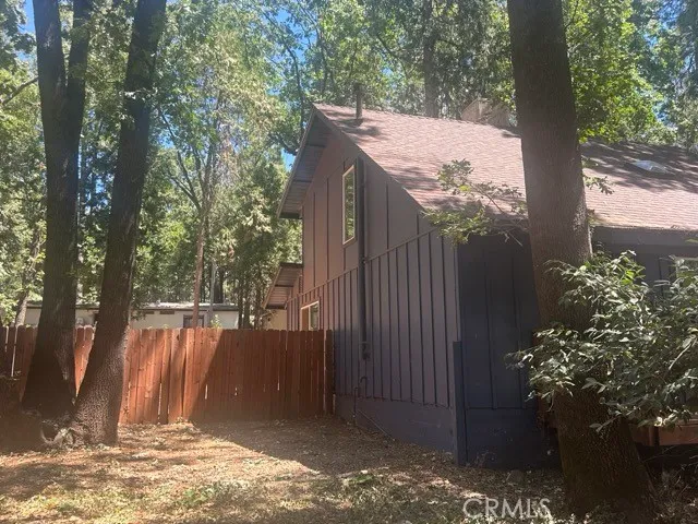 a view of a backyard with tree s