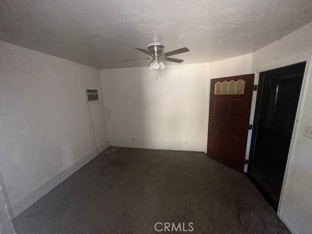 14301 Sinclair Circle Magalia, CA 95954 - Photo 9 of 13 an empty room with a window and a ceiling fan