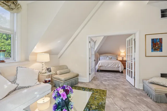 a bathroom with a sink a toilet a mirror and shower