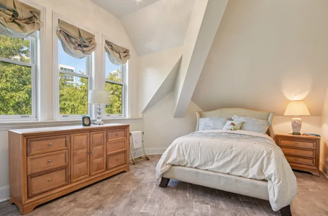a bathroom with a granite countertop sink mirror and bathtub