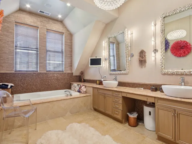 a bedroom with a bed and a view of living room