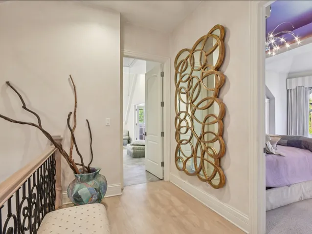 a view of a livingroom with wooden floor and stairs