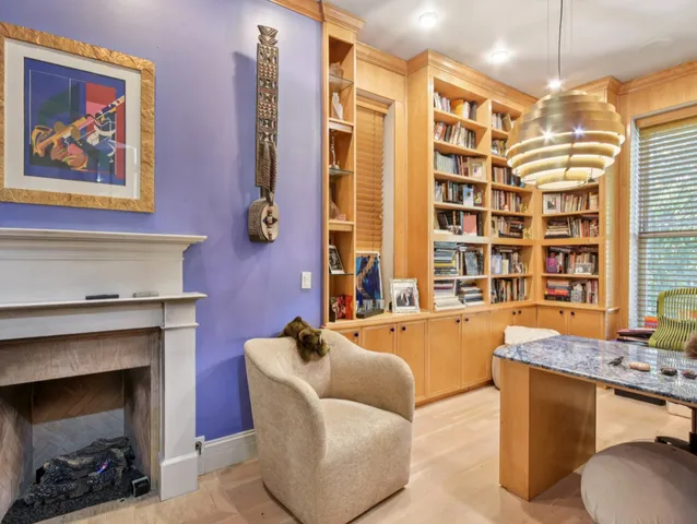 a dining room with fireplace furniture dining table and a fireplace