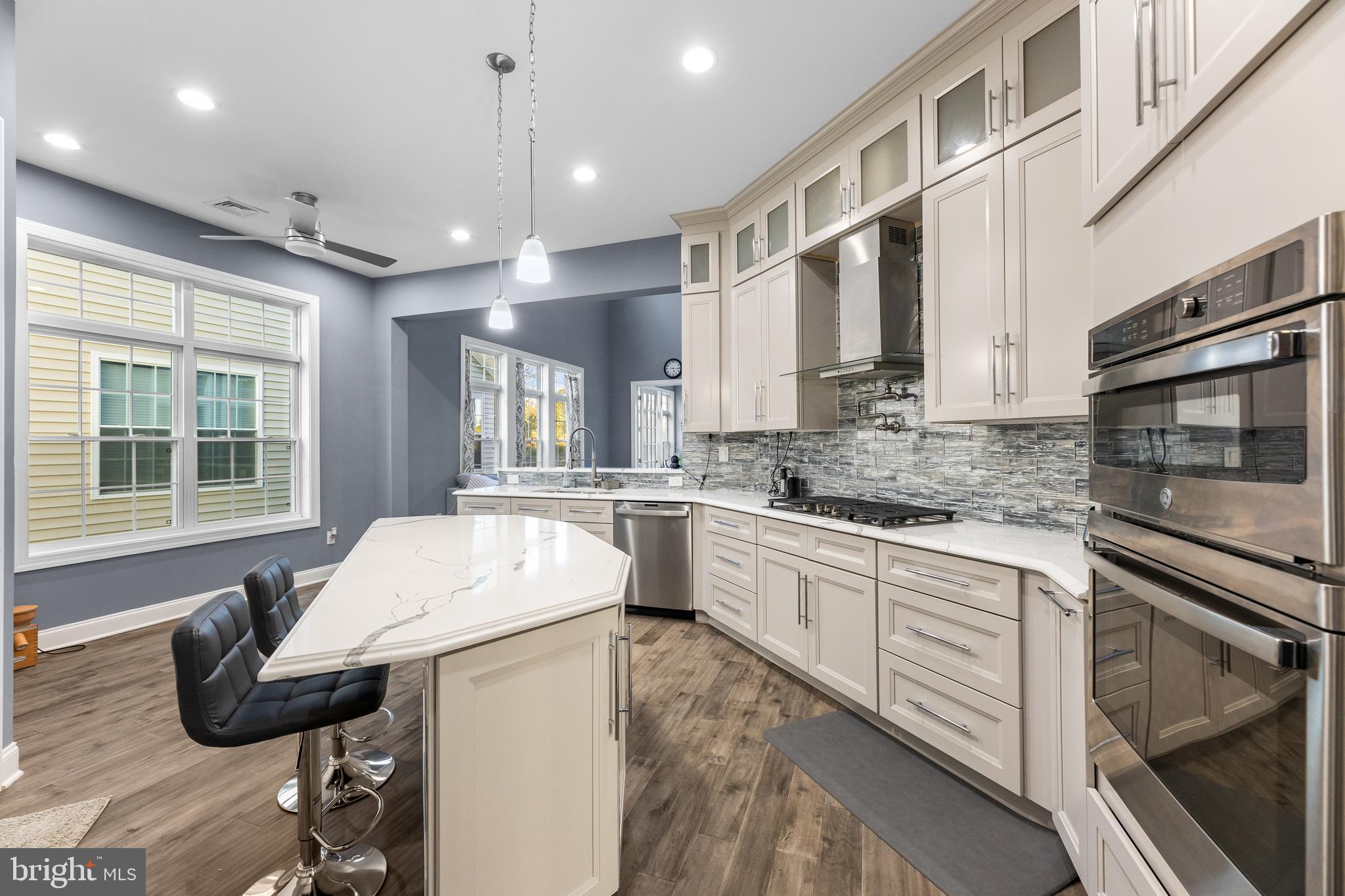 22 Samjan Circle Hightstown, NJ 08520 - Photo 12 of 31 a kitchen with a sink stainless steel appliances and windows