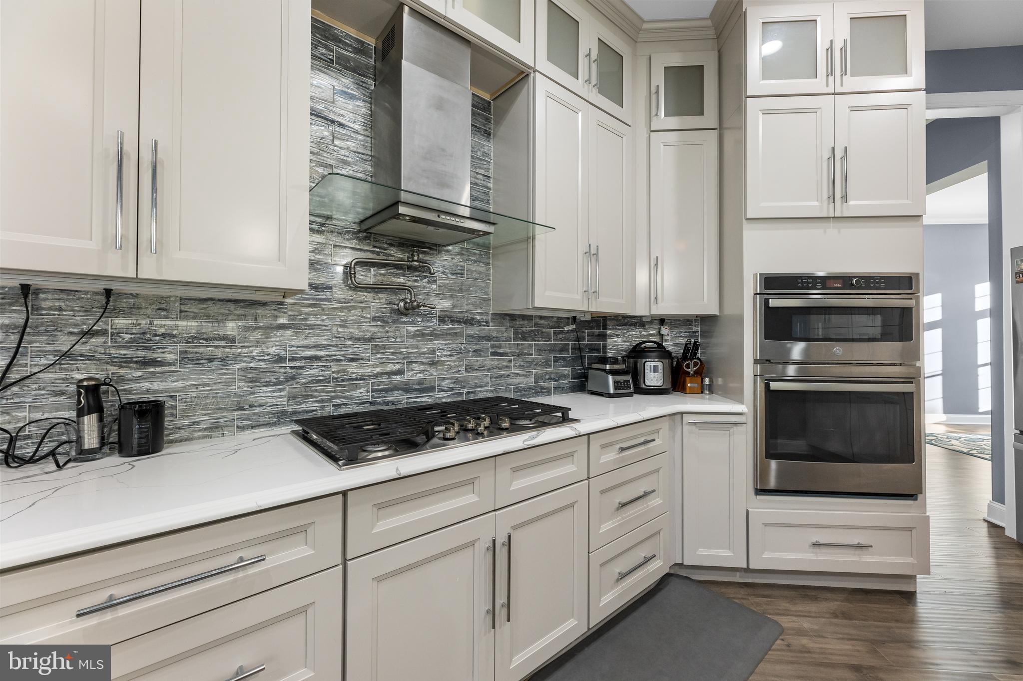 22 Samjan Circle Hightstown, NJ 08520 - Photo 13 of 31 a kitchen with white cabinets and white appliances