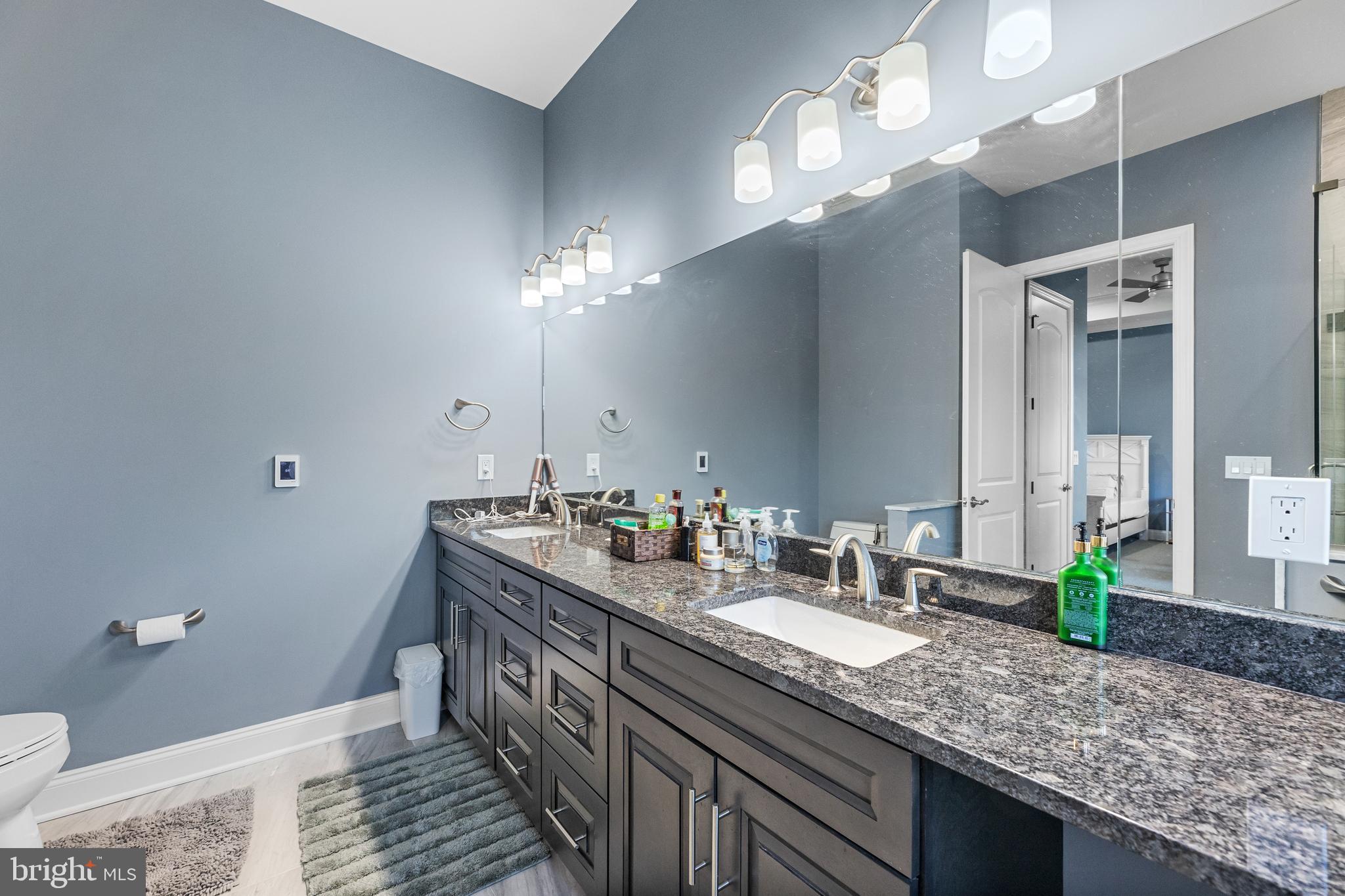 22 Samjan Circle Hightstown, NJ 08520 - Photo 27 of 31 a bathroom with a granite countertop double vanity and a mirror