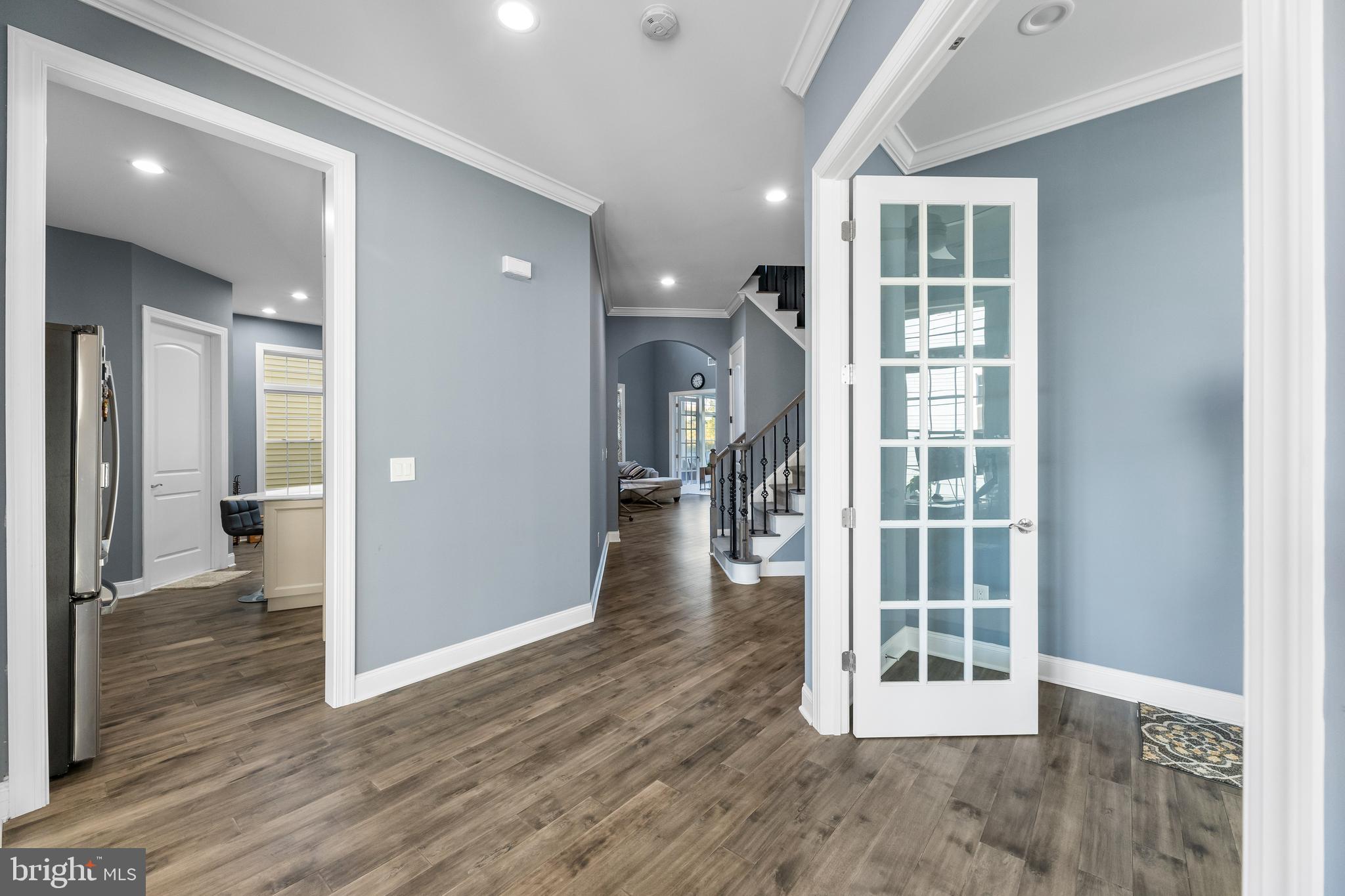 22 Samjan Circle Hightstown, NJ 08520 - Photo 7 of 31 an empty room with wooden floor and a fireplace