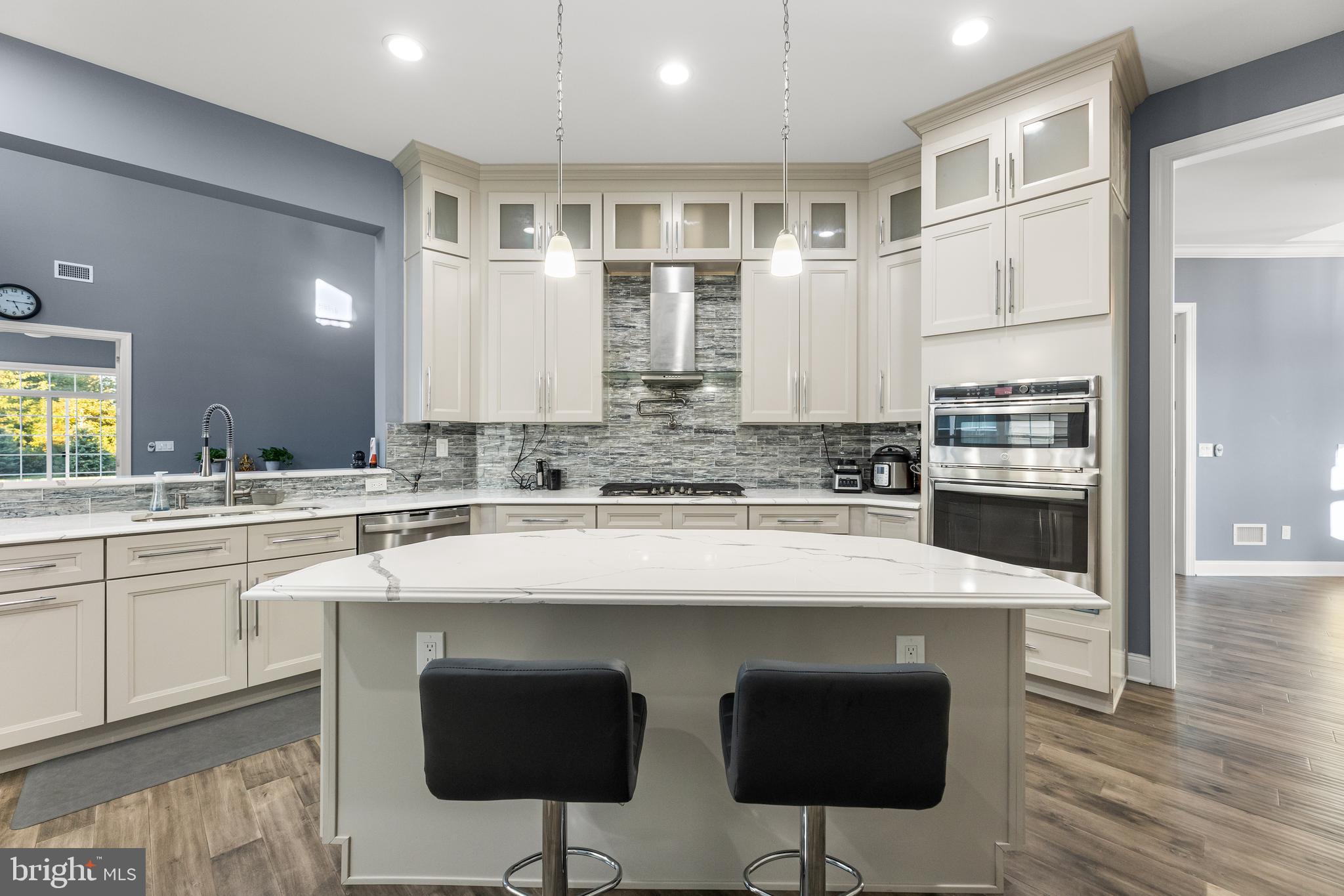 22 Samjan Circle Hightstown, NJ 08520 - Photo 10 of 31 a kitchen with stainless steel appliances a stove and cabinets