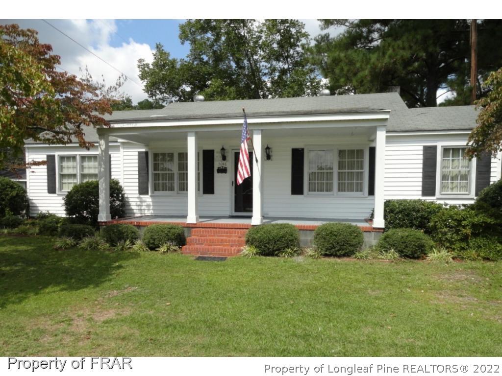 5048 Cameron Road Hope Mills, NC 28348 - Photo 1 of 15 a view of a house with a garden