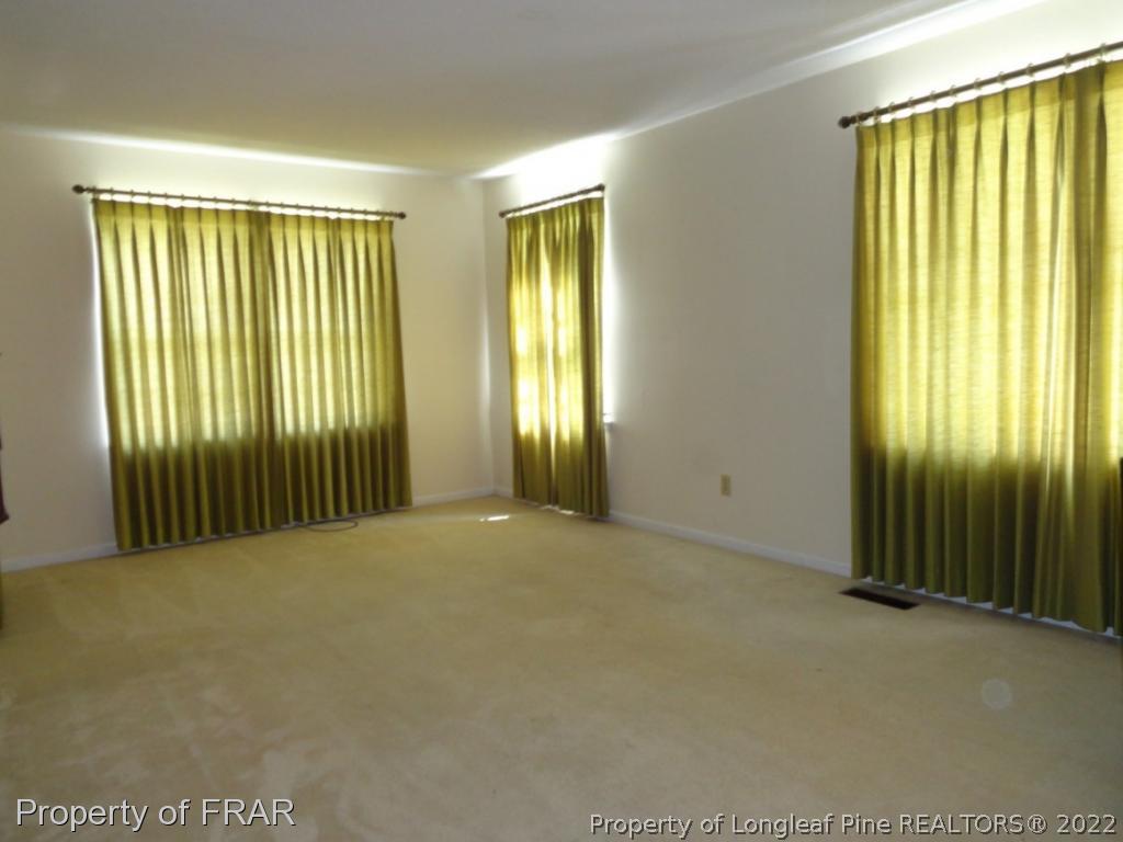 5048 Cameron Road Hope Mills, NC 28348 - Photo 5 of 15 an empty room with windows
