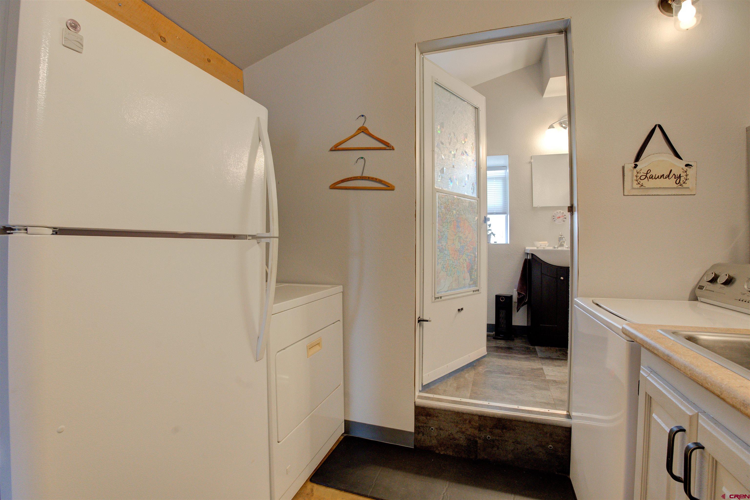 6597 Road 23 Cortez, CO 81321 - Photo 11 of 38 a view of a walk in closet and bathroom
