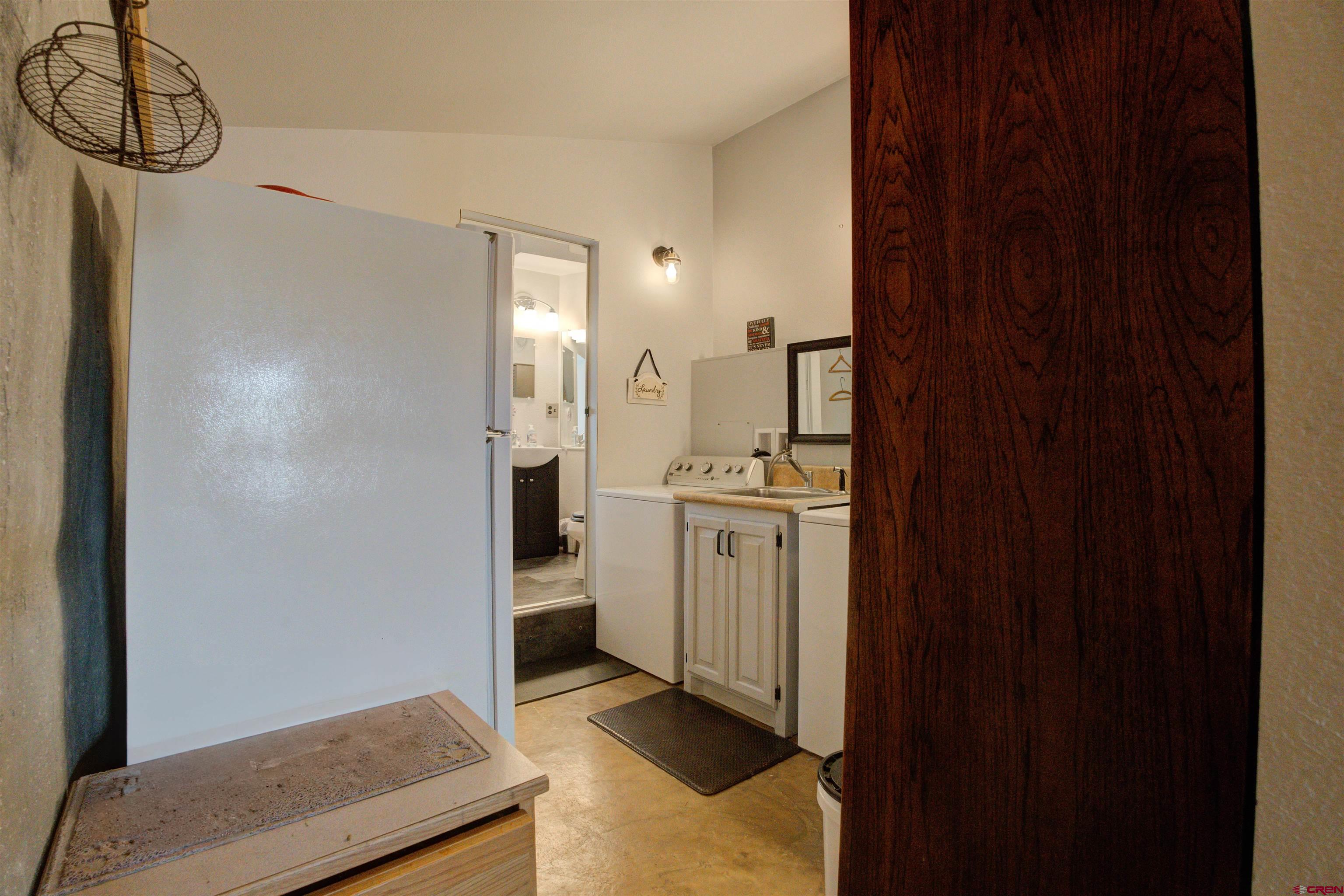 6597 Road 23 Cortez, CO 81321 - Photo 13 of 38 a bathroom with a sink and a mirror
