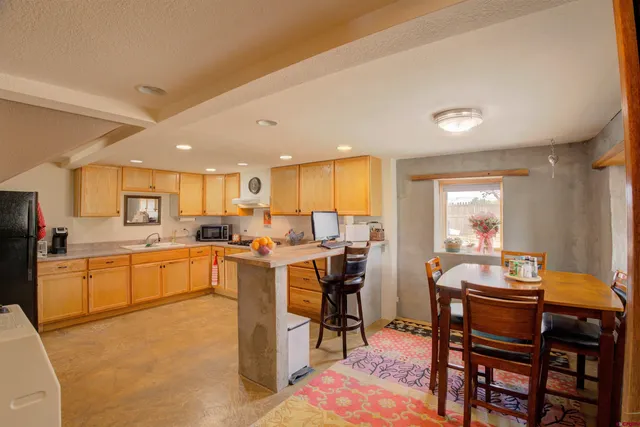 a kitchen with lots of counter top space and appliances