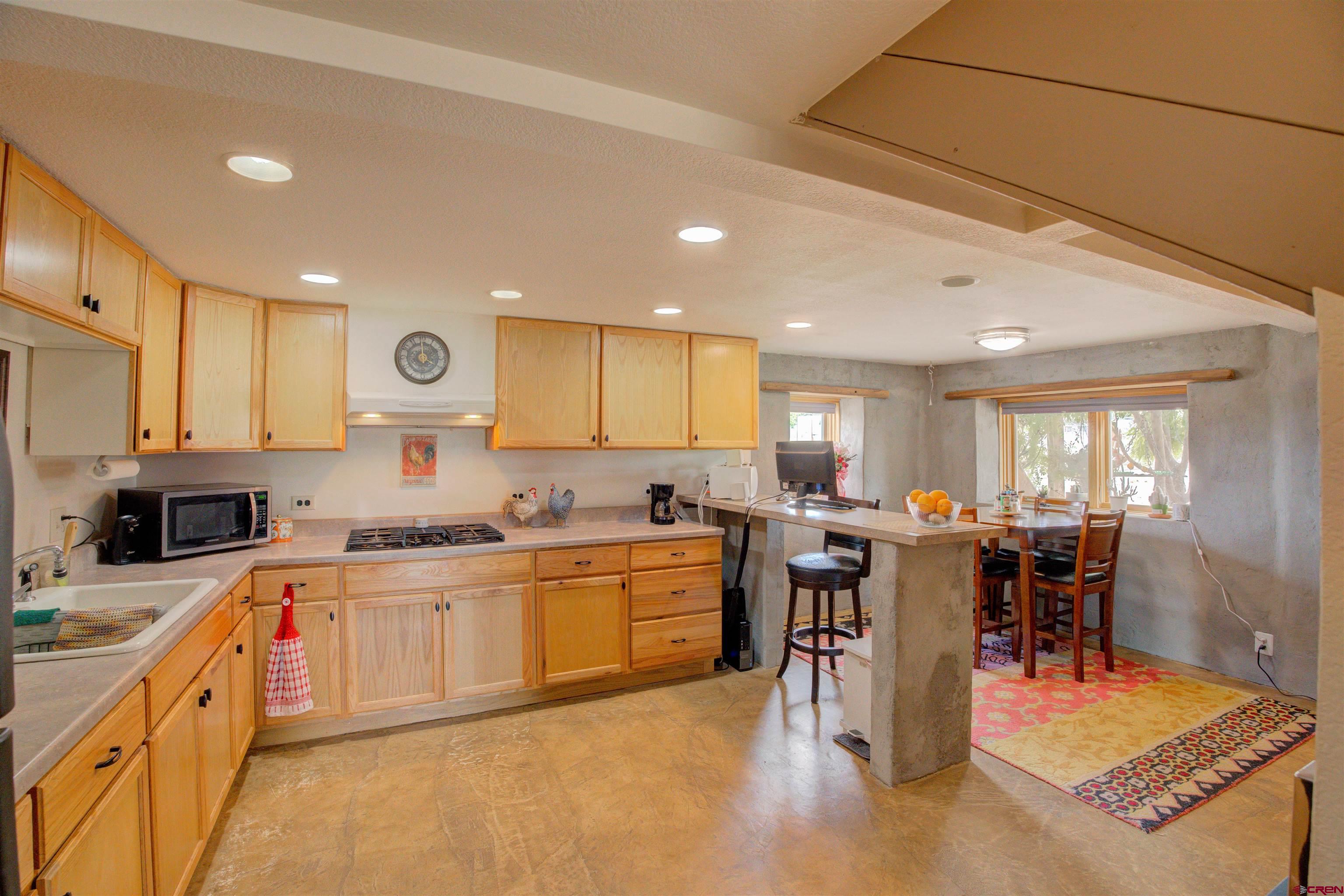 6597 Road 23 Cortez, CO 81321 - Photo 22 of 38 a kitchen with lots of counter top space and appliances