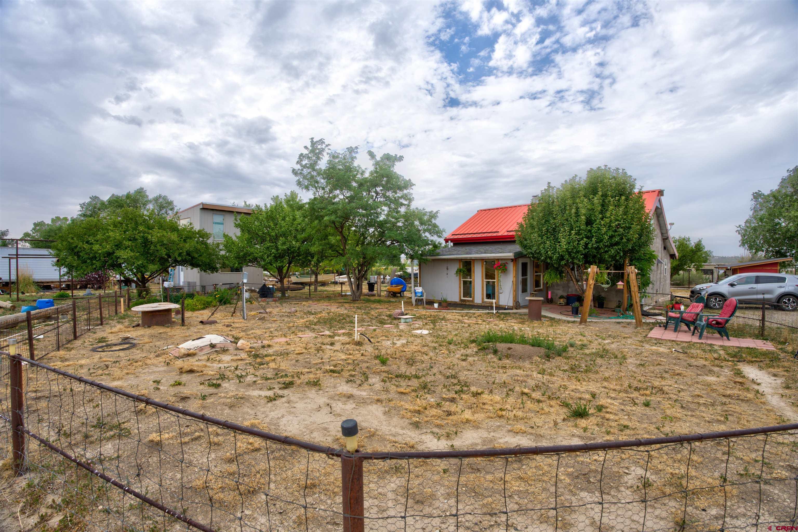 6597 Road 23 Cortez, CO 81321 - Photo 22 of 38 a view of a swimming pool with a patio