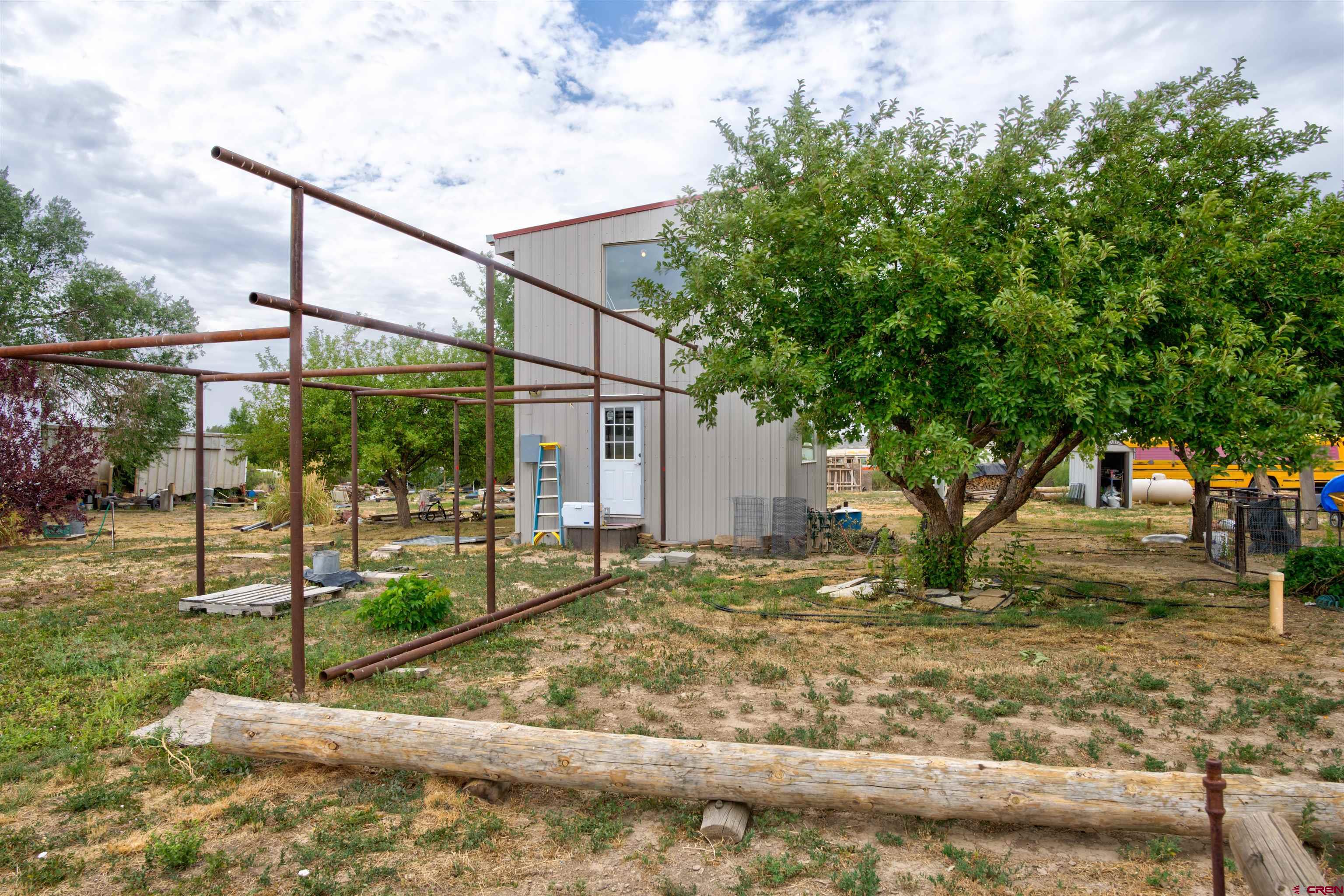 6597 Road 23 Cortez, CO 81321 - Photo 23 of 38 a backyard of a house with lots of green space
