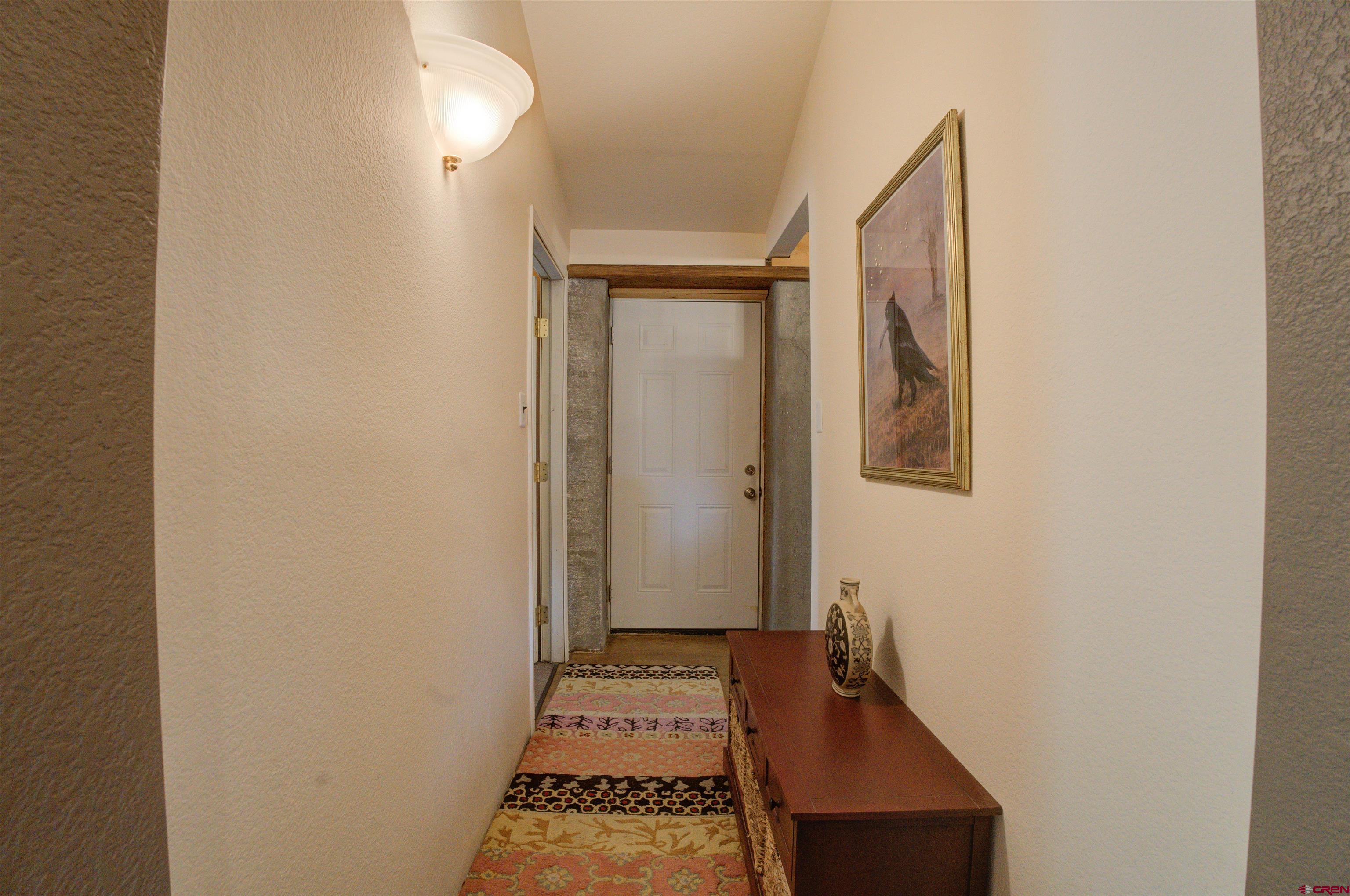 6597 Road 23 Cortez, CO 81321 - Photo 24 of 38 a view of an entryway with wooden floor