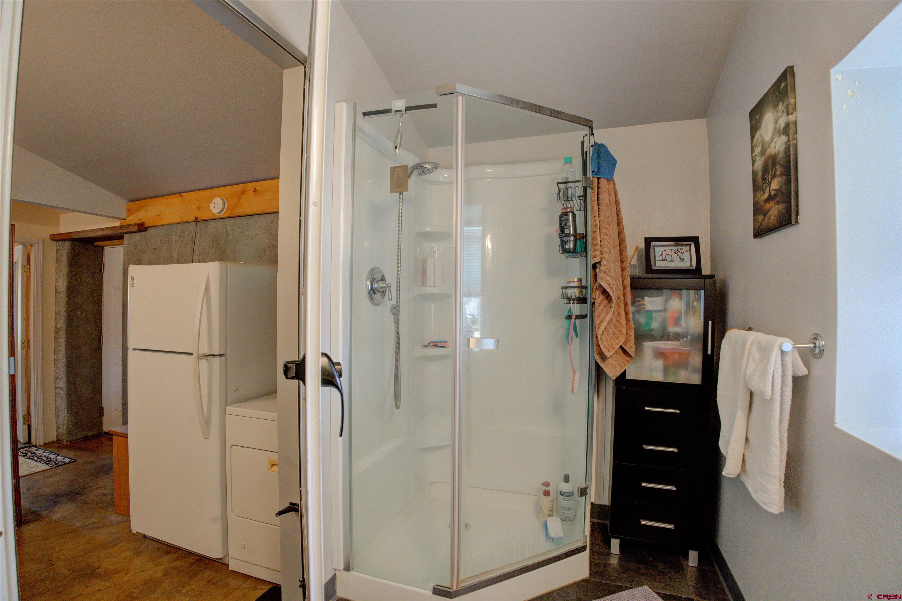 6597 Road 23 Cortez, CO 81321 - Photo 30 of 38 a bathroom with a shower