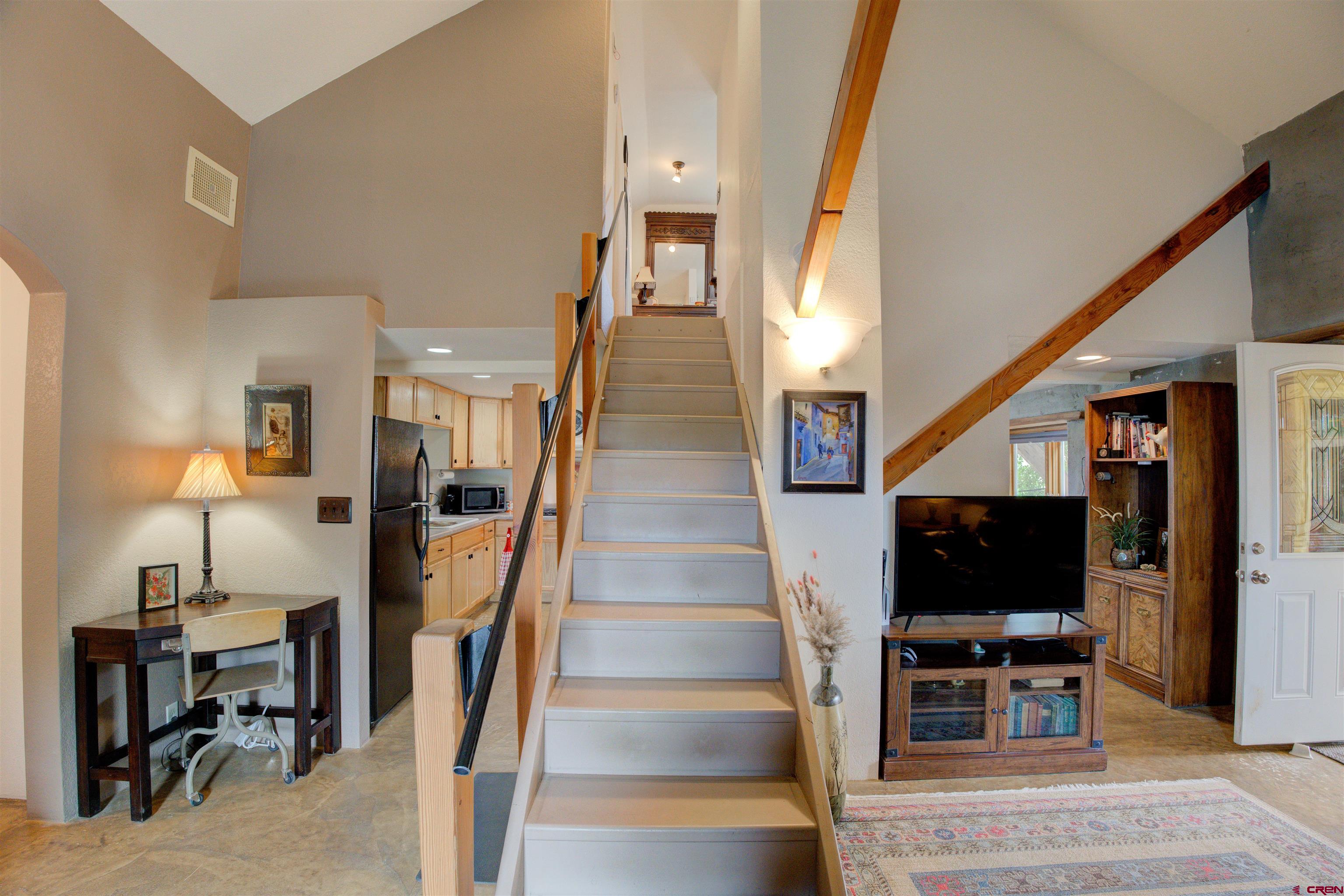 6597 Road 23 Cortez, CO 81321 - Photo 32 of 38 a view of a livingroom with furniture and stairs