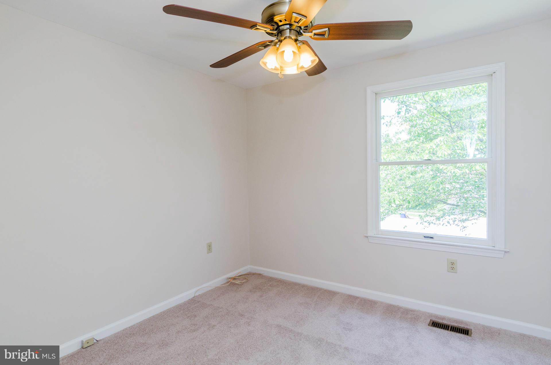 3123 Ripple Road Baltimore, MD 21244 - Photo 11 of 29 an empty room with a window and a fan