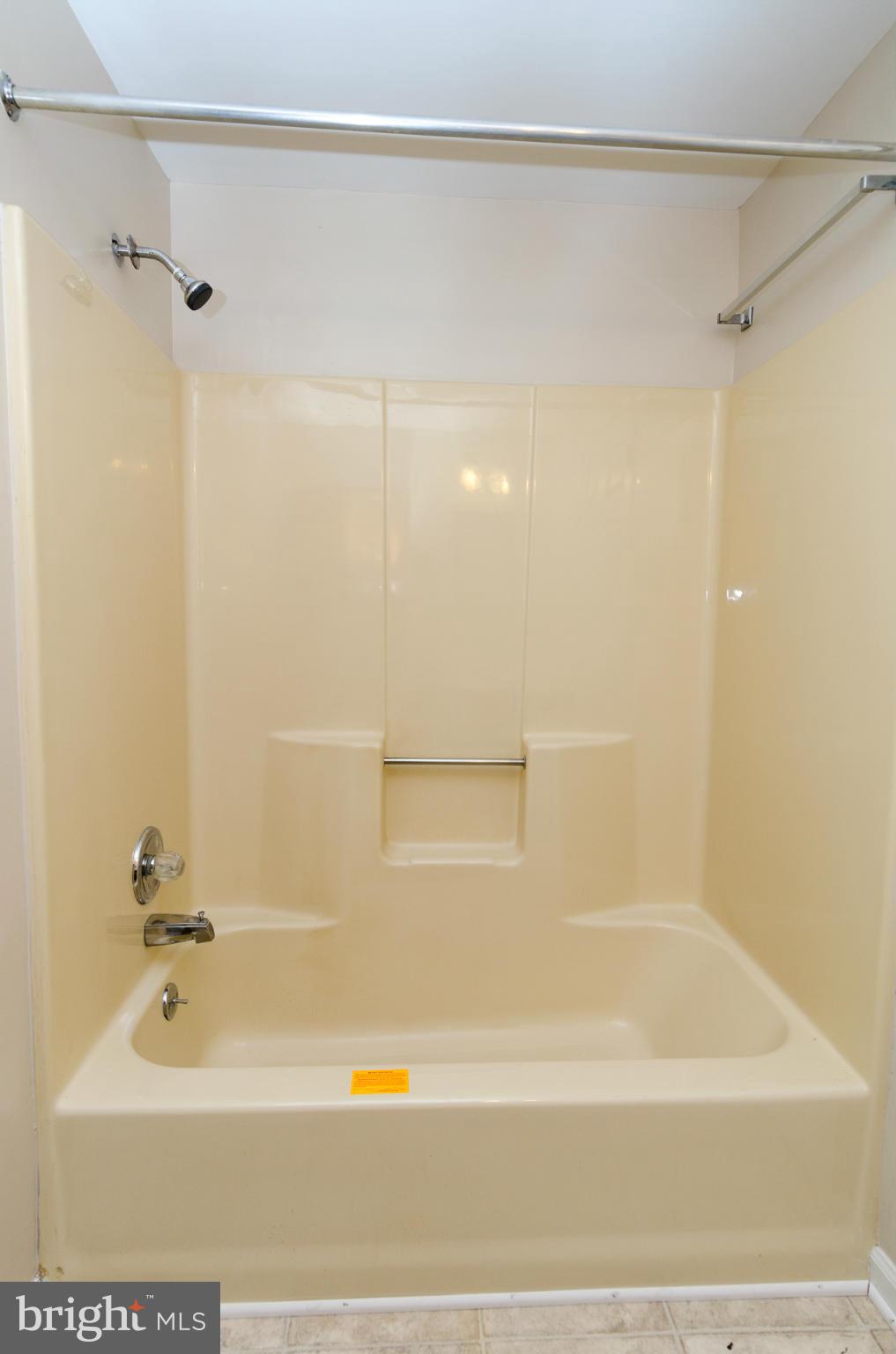 3123 Ripple Road Baltimore, MD 21244 - Photo 14 of 29 a bathroom with a shower and a bath tub
