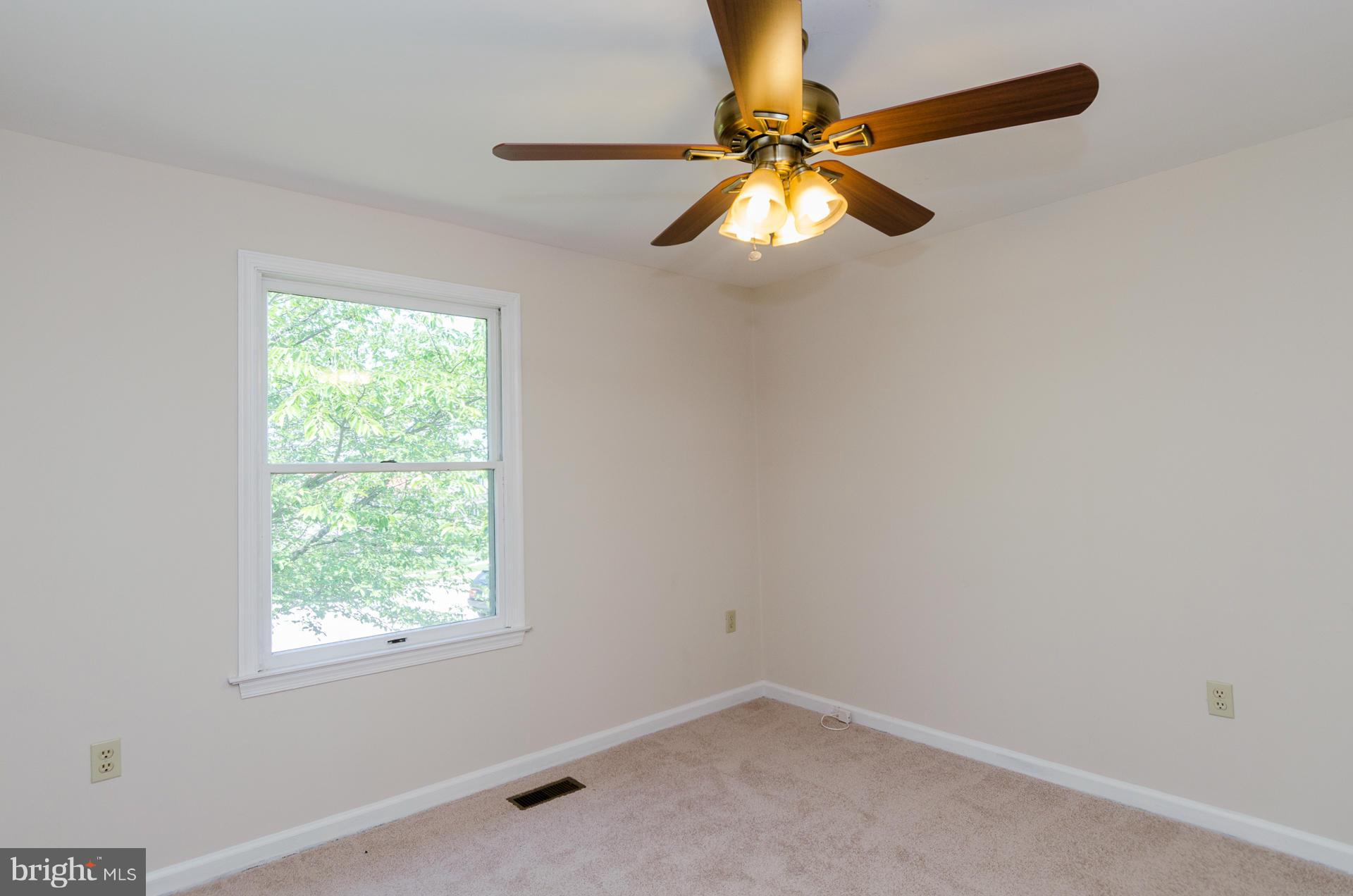 3123 Ripple Road Baltimore, MD 21244 - Photo 15 of 29 an empty room with a window and a fan