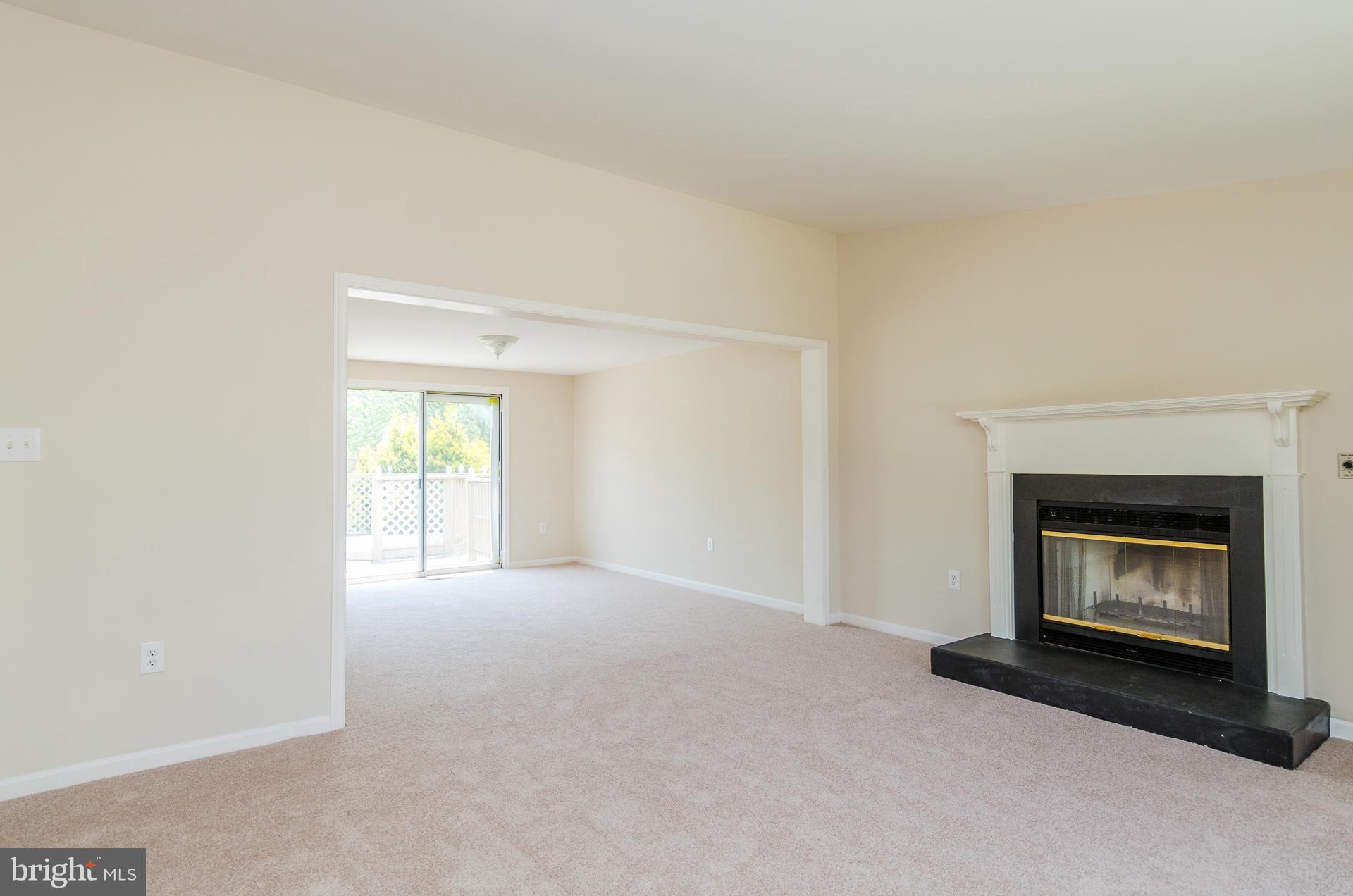 3123 Ripple Road Baltimore, MD 21244 - Photo 3 of 29 a view of empty room with a fireplace