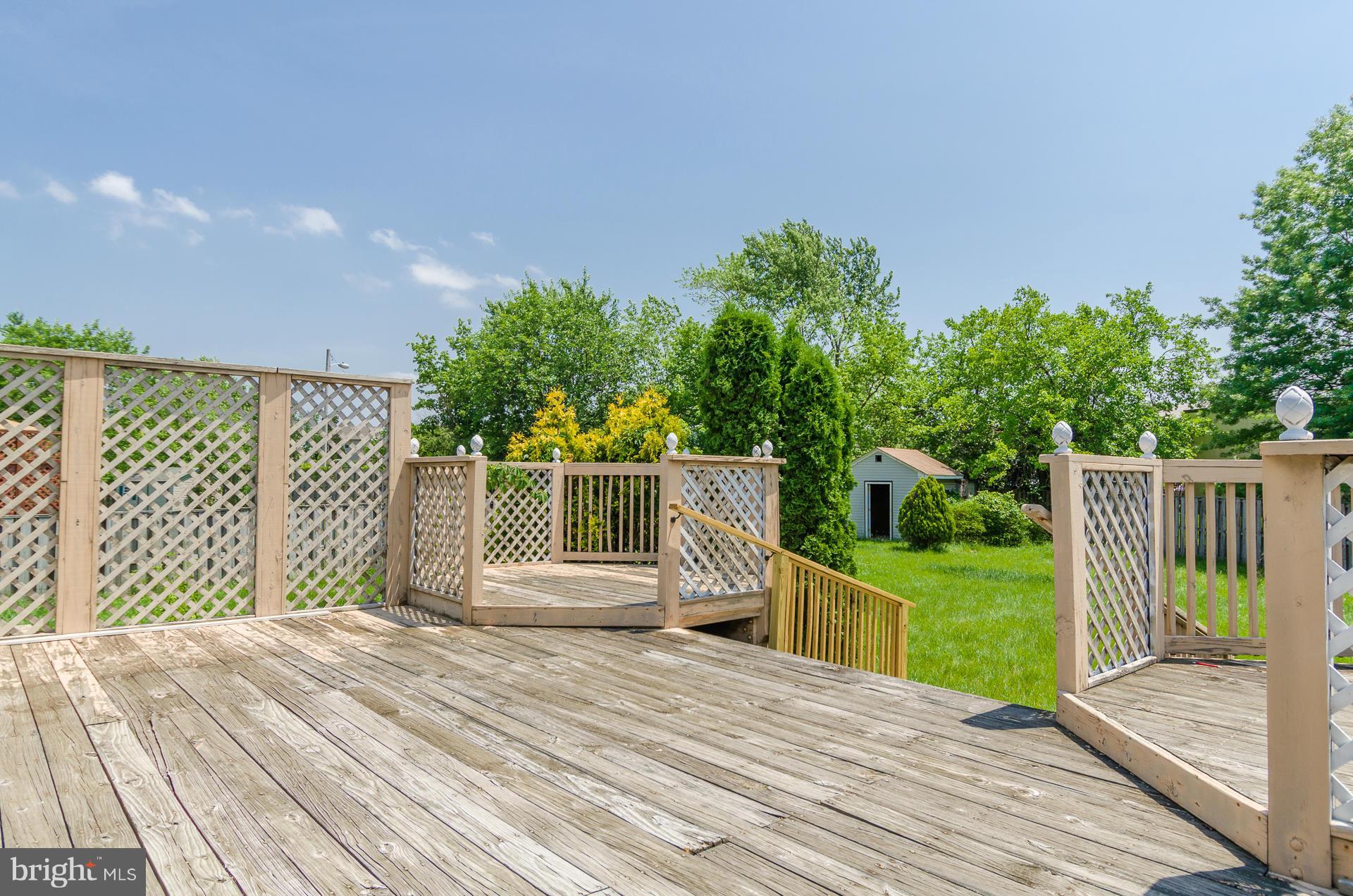 3123 Ripple Road Baltimore, MD 21244 - Photo 21 of 29 a view of a deck with wooden floor and fence